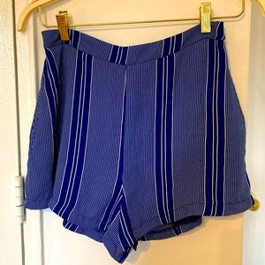 Nautical striped shorts with pockets and a zip up closure.
